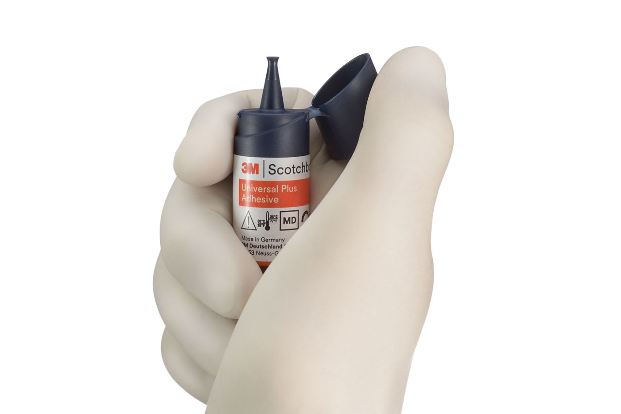 3M Scothbond Universal Plus Adhesive Vial opened by hand,