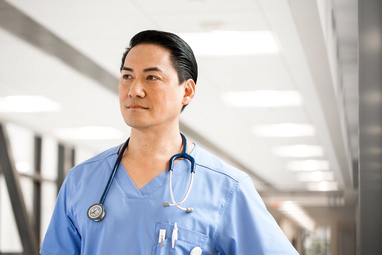 Portrait of a male nurse in the hospital hallway