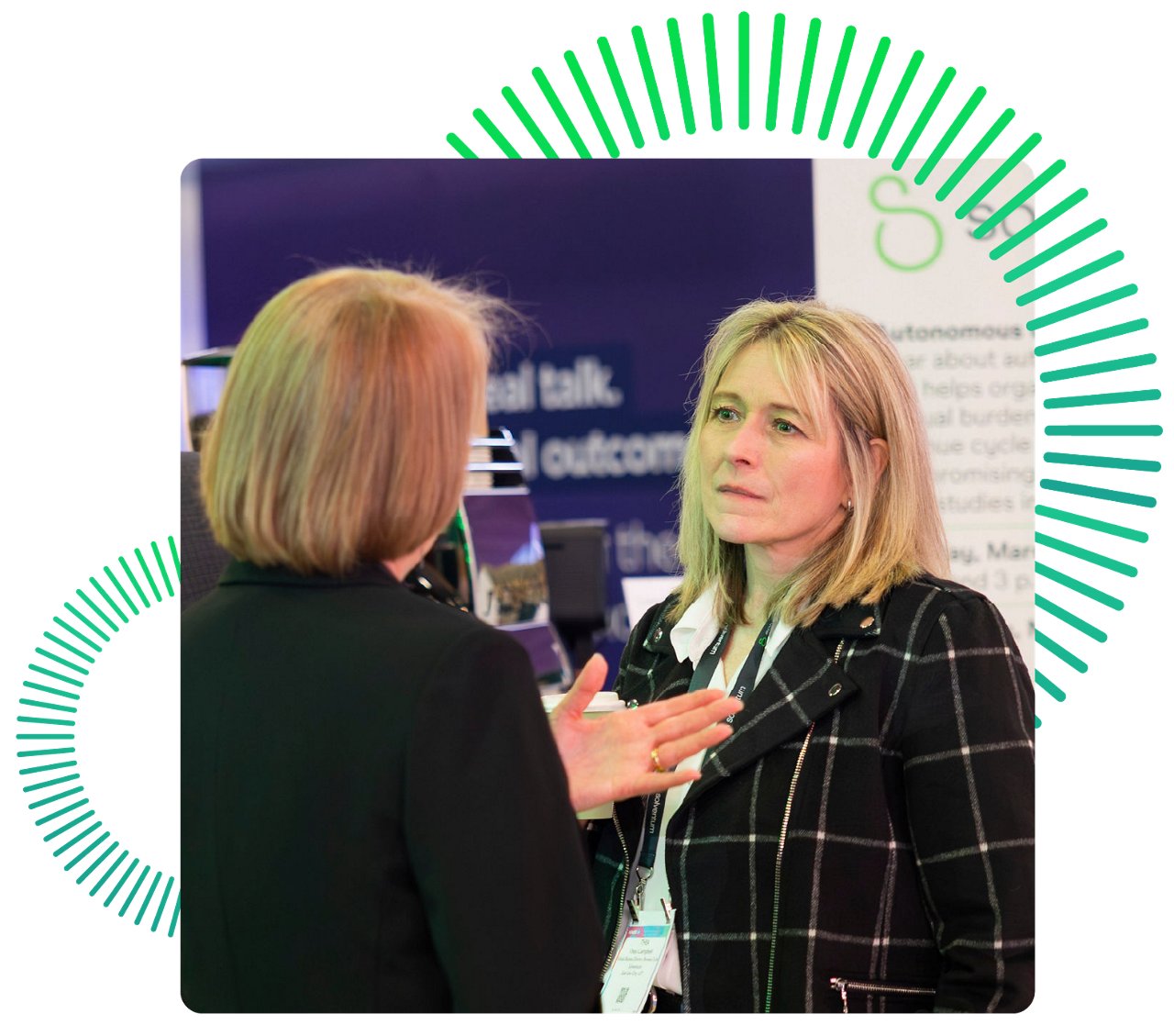 Two women speaking at the Solventum booth