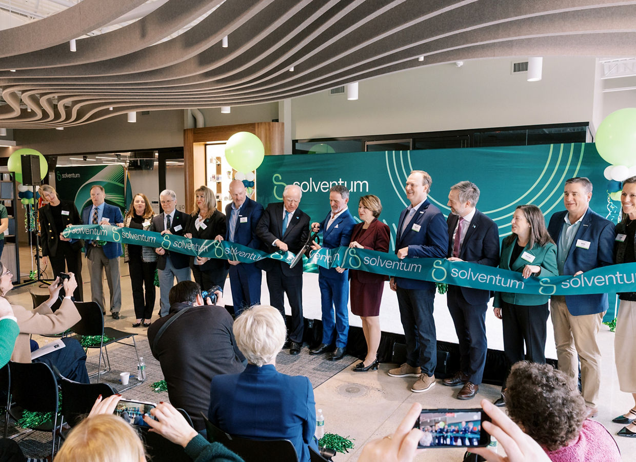 Solventum leaders cutting the ribbon at the Eagan site opening