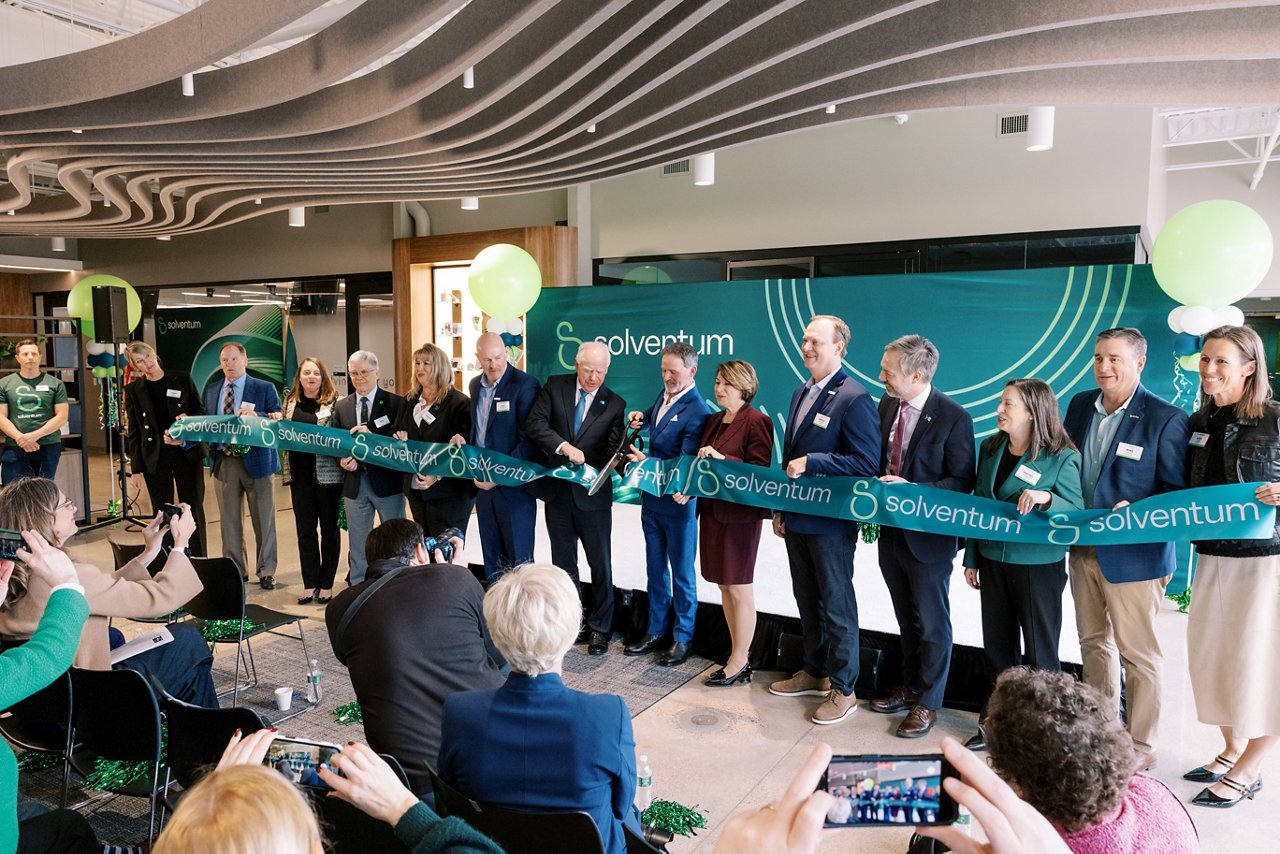 Solventum leaders cutting the ribbon at the Eagan site opening