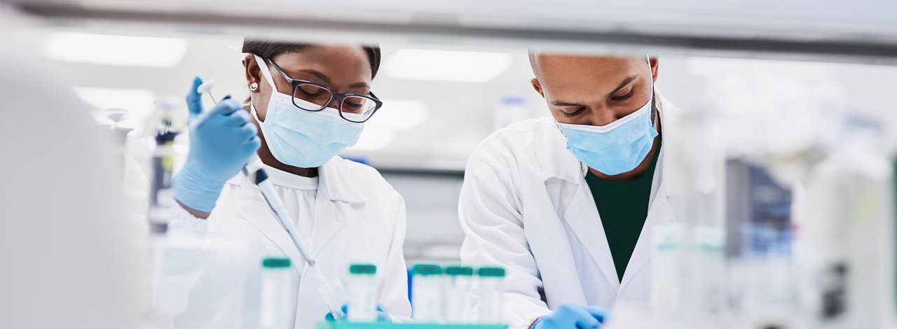 Two male scientists in working in a lab