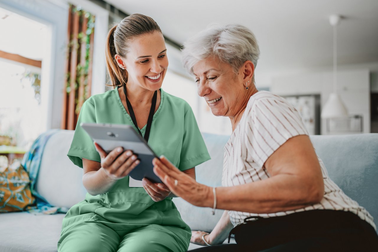 Nurse and patient viewing content on a tablet