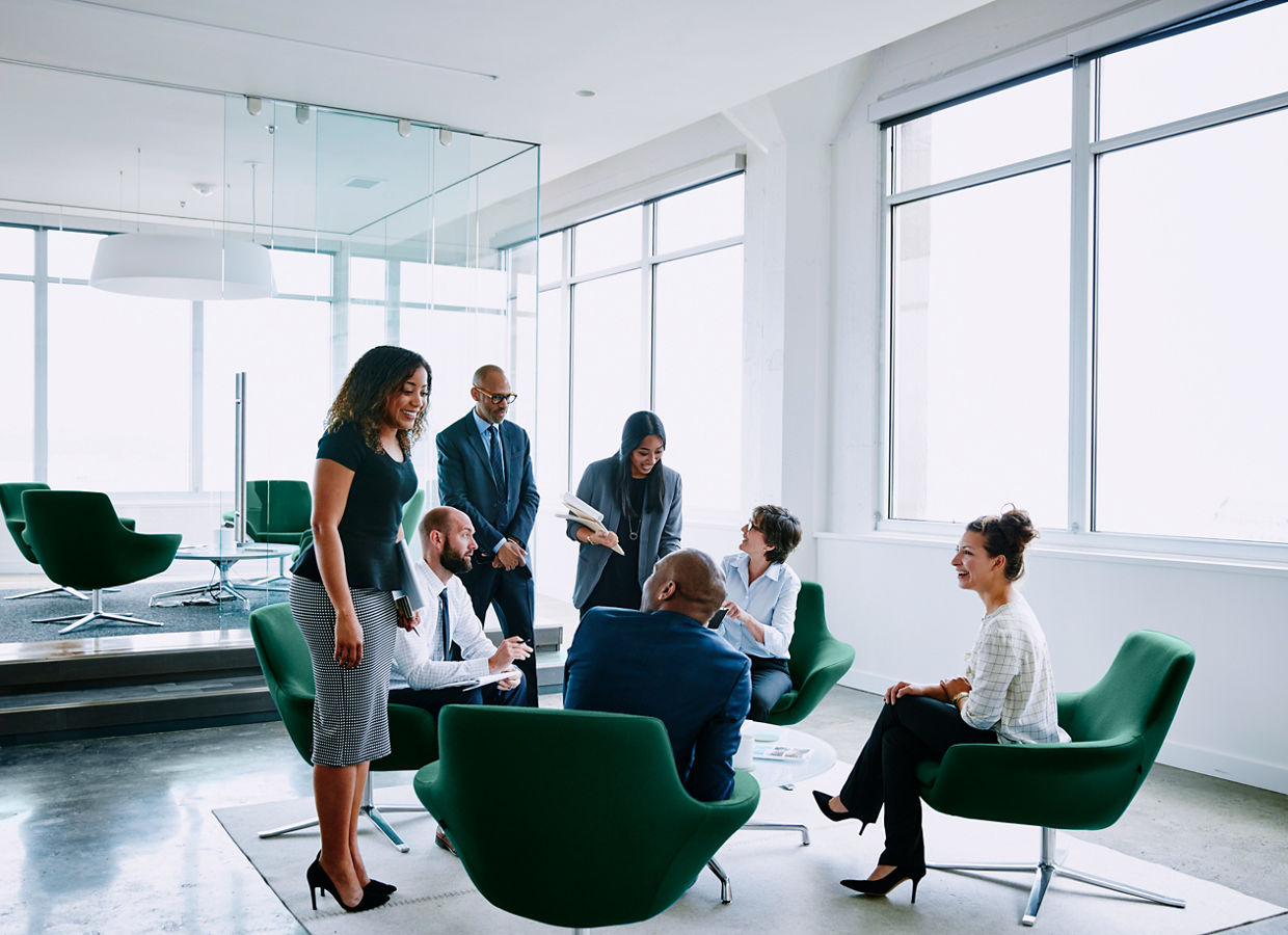 Group of businesspeople in discussion during project meeting in office