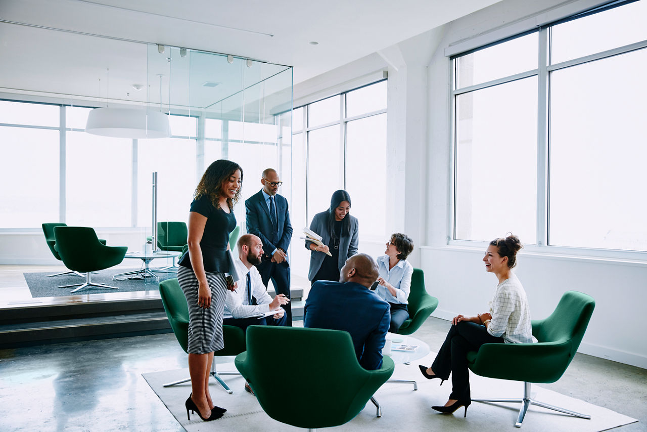 Group of business people in discussion during project meeting in office