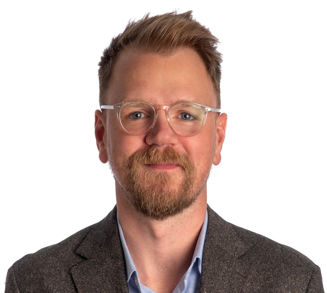 Studio portrait of a professional individual captured against a neutral background. The image emphasizes clarity and consistent visual presentation for use in corporate communications, team profiles, and visual storytelling.