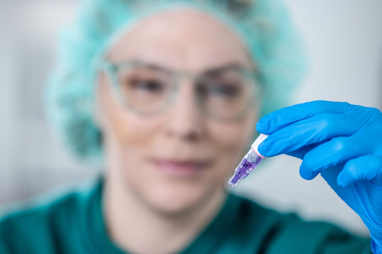 Image showing examination of a biological indicator to confirm sterilization effectiveness.